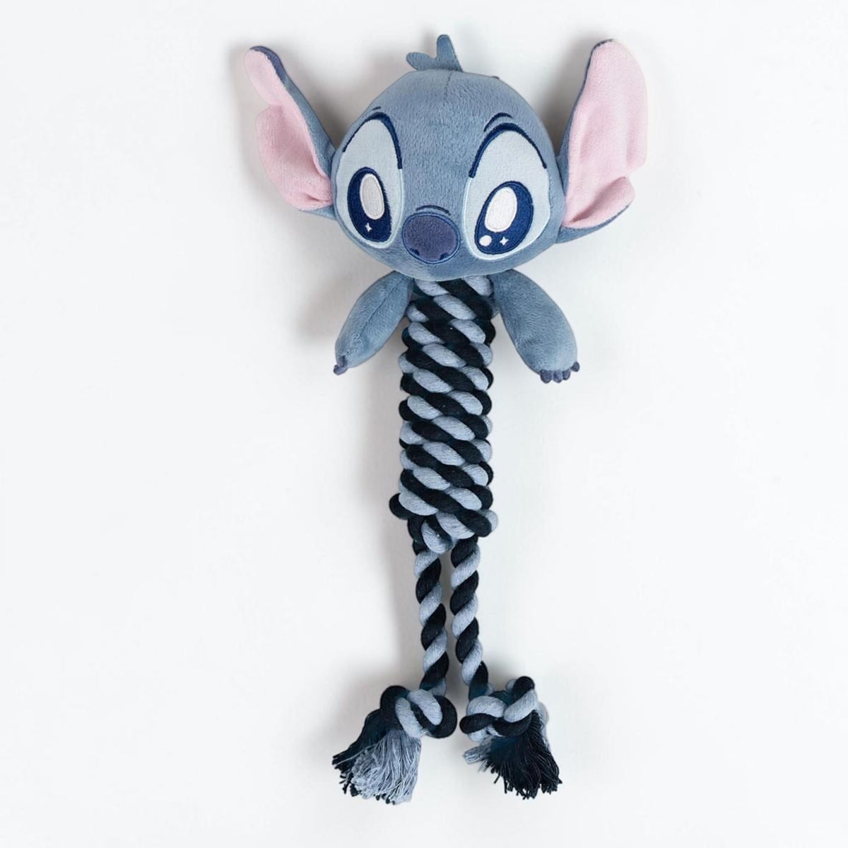 Gioco per cani in fune dentale bicolore da 30 cm con nodi ed estremità sfilacciate e testa in morbido peluche ricamato di Stitch Disney.