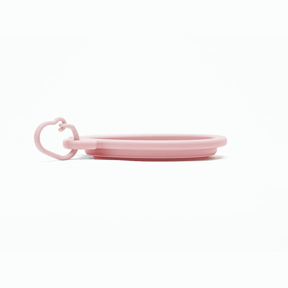 Ciotola da viaggio Muzzle Bowl di United Pets ripiegata, vista di profilo con anello di aggancio